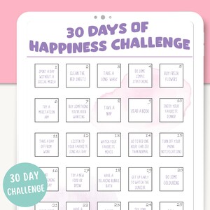 May include: A printable 30-day happiness challenge checklist with 25 daily activities to promote well-being. The checklist is organized in a grid with each activity listed in a white box with a black border. The background is a light pink watercolor wash.