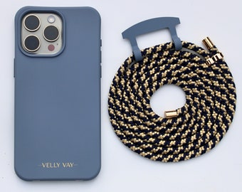 May include: A blue phone case with a black and gold phone strap. The phone case has the text "Velly Vay" printed on the back.
