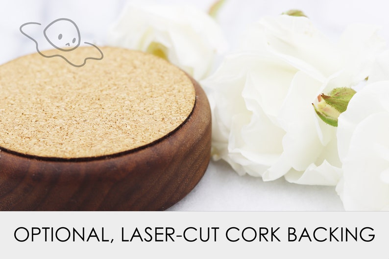 May include: A round, wooden coaster with a cork backing. The coaster is brown with a natural wood finish. The cork backing is a light brown colour.