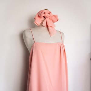 1970s baby pink cocktail dress featuring layers of delicate sheer fabric and a matching scarf // size small