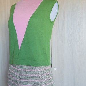May include: A sleeveless green and pink knit top with a pink and green striped skirt.