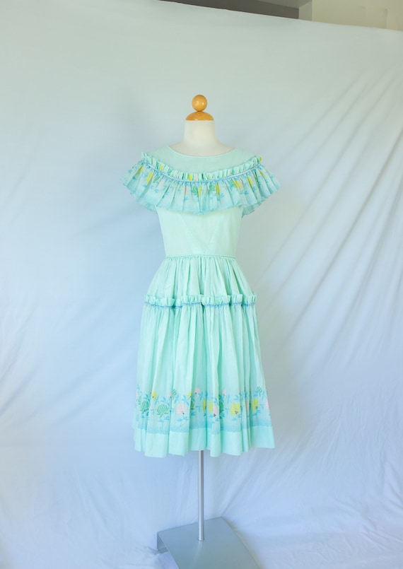 Pastel Green Flounce Dress with Floral Trim and Rh