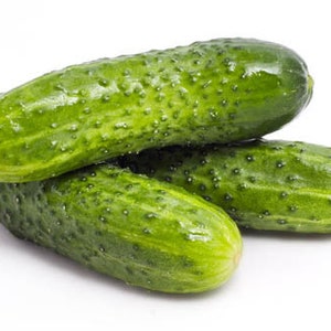 May include: Three green cucumbers with a bumpy texture, arranged in a pile on a white background.