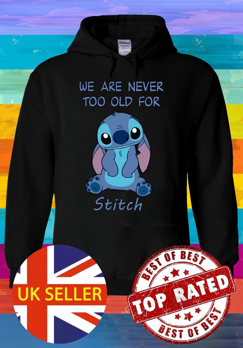 May include: Black hoodie with a blue Stitch character from the Disney movie Lilo & Stitch. The text "We are never too old for Stitch" is printed on the hoodie.