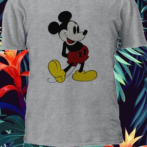 May include: A gray t-shirt with a black and white image of Mickey Mouse. Mickey Mouse is wearing red shorts and yellow shoes. He is smiling and looking to the right.
