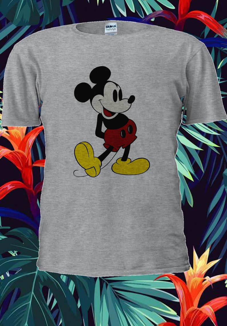May include: A gray t-shirt with a black and white image of Mickey Mouse. Mickey Mouse is wearing red shorts and yellow shoes. He is smiling and looking to the right.