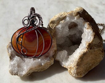 Carnelian wire wrapped pumpkin pendant in Antiqued Copper