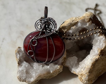 Carnelian wire wrapped pumpkin pendant in Antiqued Copper