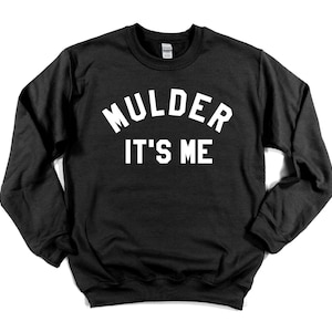 May include: Black sweatshirt with white text that reads "Mulder It's Me" in an arched font.