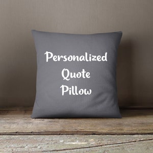 May include: A gray throw pillow with the text "Personalized Quote Pillow" in white.