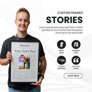 May include: A custom framed newspaper-style print titled 'Truly God's Plan' featuring four photographs and text. The black wooden frame includes a plexiglass front. The print displays the 'Frontpage Weddings' logo and custom headlines.