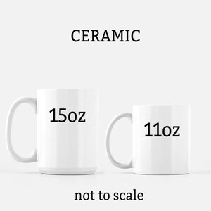 May include: Two white ceramic mugs, one 15 oz and one 11 oz, on a white background. The text "CERAMIC" is above the mugs, and "not to scale" is below the mugs.
