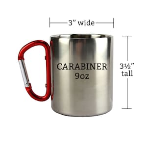 May include: A stainless steel travel mug with a red carabiner handle. The mug is 3 inches wide and 3 1/2 inches tall. It has the text "CARABINER 9oz" printed on the side.