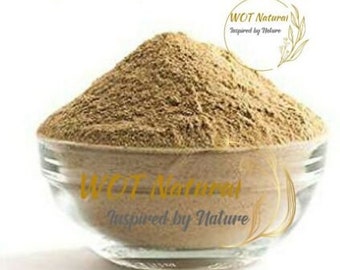 May include: A close-up of a light brown powder in a glass bowl. The powder is labeled "Kigelia African Djant", "WOT Natural Inspired by Nature".