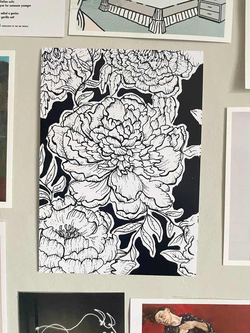 May include: Black and white line art print of peonies on a black background. The peonies are drawn in a detailed and realistic style.