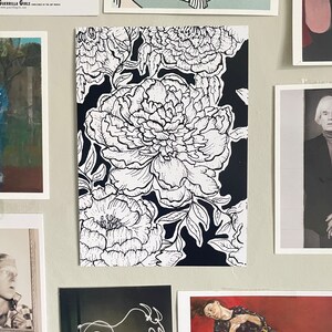 May include: Black and white line art print of peonies on a black background. The peonies are in full bloom and have a detailed design.