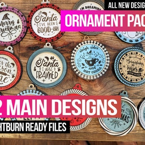May include: Twelve Christmas ornament designs, ready to be cut on a laser cutter. The designs include phrases like "This the season to wine", "Santa I was framed", and "Sleigh rides and hot cocoa".