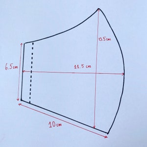 May include: A black and white line drawing of a face mask pattern with measurements in centimetres. The pattern includes a 13.5 cm tall curved top, a 10 cm wide bottom, and a 14.5 cm wide middle section.