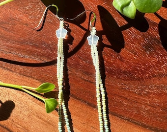 Beaded fringe earrings Native American made with blue and green beads and a star charm
