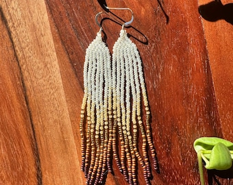 Beaded fringe earrings with brown, gold and white beads. Native American made.
