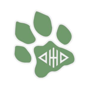 May include: Green paw print sticker with a white monogram of the letters "DHD" inside.