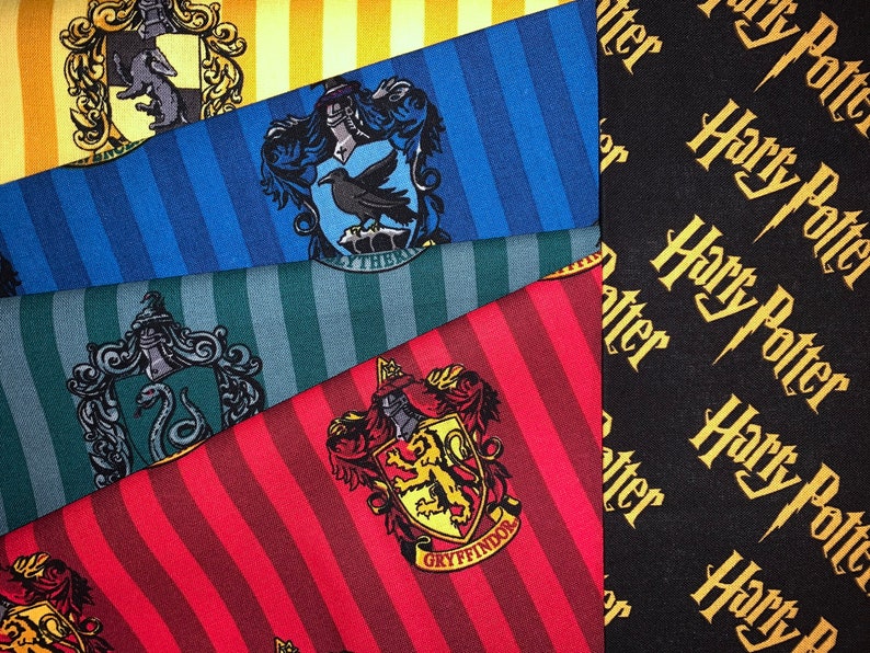 May include: Four different Harry Potter house fabrics with striped patterns and crests. The houses are Gryffindor, Slytherin, Hufflepuff, and Ravenclaw. The fabrics are all black, red, blue, and green.