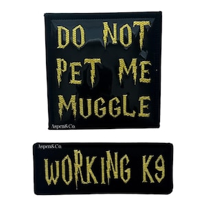 May include: Black patches with gold text. One patch reads "DO NOT PET ME MUGGLE". The other patch reads "WORKING K9". Both patches are rectangular and have the Aspen & Co. logo.
