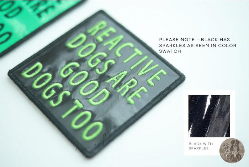 Black holographic dog patch with the text 'Reactive Dogs Are Good Too' in green embroidery. The black patch has sparkles.
