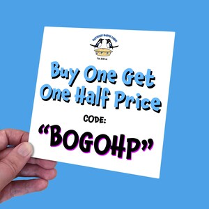 May include: White card with blue text that reads "Buy One Get One Half Price" and "CODE: "BOGOHP"".  The card also has a logo with two blue birds on a pie crust.
