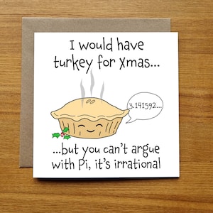 May include: A white card with a humorous Christmas greeting. The card features a cartoon pie with a face and the text "I would have turkey for xmas... but you can't argue with Pi, it's irrational".