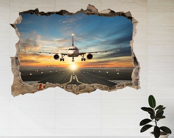 May include: A white aeroplane is landing on a runway with a sunset in the background. The image is a 3D effect, as if the plane is breaking through the wall.
