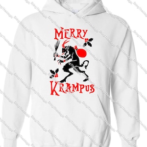 May include: White hooded sweatshirt with a red and black graphic of a horned creature holding a stick and a sack. The text "Merry Krampus" is printed in red.