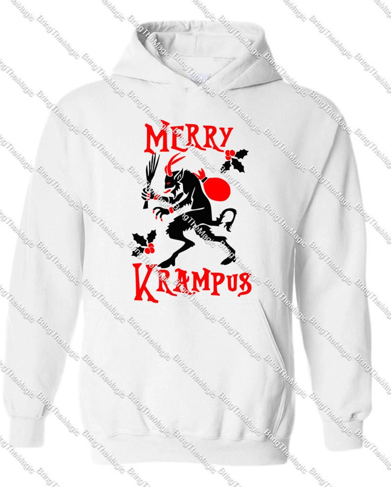 May include: White hooded sweatshirt with a red and black graphic of a horned creature holding a stick and a sack. The text "Merry Krampus" is printed in red.