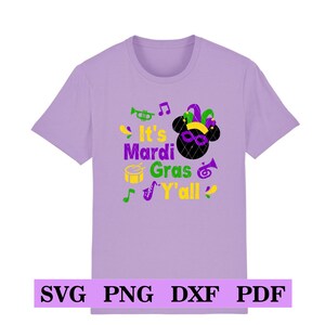 May include: Purple t-shirt featuring a cartoon mouse wearing a jester hat and the text "It's Mardi Gras Y'all".