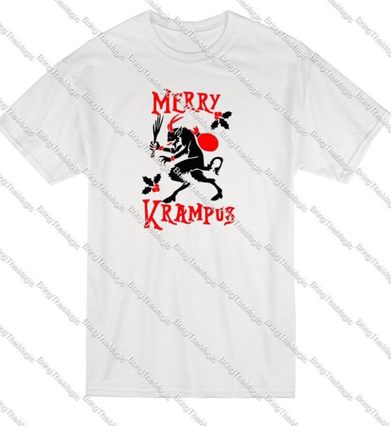 May include: White t-shirt with a red and black graphic of a horned creature holding a whip and a sack. The text "Merry Krampus" is printed in red.