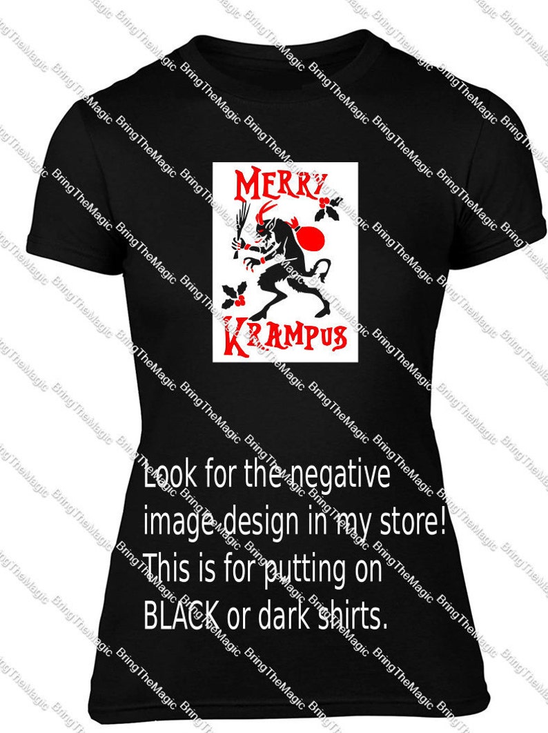 May include: Black t-shirt with a red and white graphic of a horned creature with the text "Merry Krampus". The text "Look for the negative image design in my store! This is for putting on BLACK or dark shirts." is printed below the graphic.