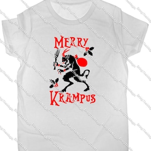 May include: White t-shirt with a red graphic of a horned creature holding a sack and a stick. The text "Merry Krampus" is printed in red below the creature.