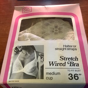 May include: A white lace stretch wired bra with halter or straight straps. The bra is labeled "Stretch Wired Bra" and "medium cup" with a bust size of 36 inches. The packaging is pink and white with the brand name "Frova" printed on it.