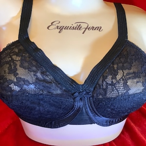 May include: Black lace bra with adjustable straps and a bow detail in the centre. The bra is made by Exquisite Form.