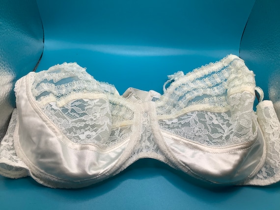 Sheer white lace and satin bra