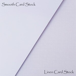 May include: Close-up of two pieces of card stock, one smooth and one with a linen texture. The top piece says "Smooth Card Stock" and the bottom piece says "Linen Card Stock".