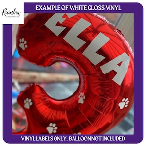 May include: Red balloon with white paw prints and the name "ELLA" in white vinyl lettering. The balloon is not included, only the vinyl labels.