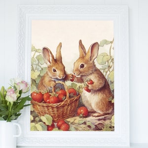 May include: Two brown rabbits with long ears are sitting in a field of green leaves and red strawberries. One rabbit is holding a basket full of strawberries, while the other rabbit is eating a strawberry.