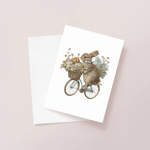 Conejo conejo en una tarjeta de felicitación de bicicleta, tarjeta de ilustración de acuarela, tarjeta de aniversario entusiasta del ciclismo Tarjeta de cumpleaños Cottagecore, lindo regalo