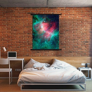 May include: A wall tapestry featuring a vibrant nebula with shades of green, pink, and blue. The nebula is filled with stars and a swirling cloud of gas and dust.