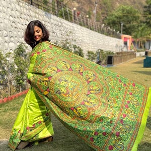 Kosh By Sanyukta Exclusive Hand Painted Madhubani Silk Saree. Duty Free Delivery. Worldwide free delivery.