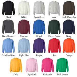 May include: A chart of 18 different colored sweatshirts. The colors include black, white, sport grey, ash, dark chocolate, dark heather, maroon, royal, forest green, navy, carolina blue, light blue, purple, red, orange, gold, light pink, and heliconia.