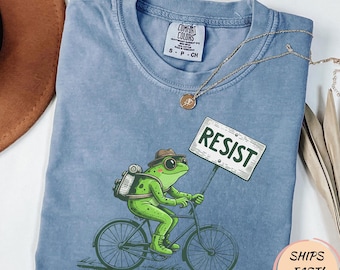 自転車に乗ったカエル、ポートランド・フロッグ抗議に抵抗するTシャツ