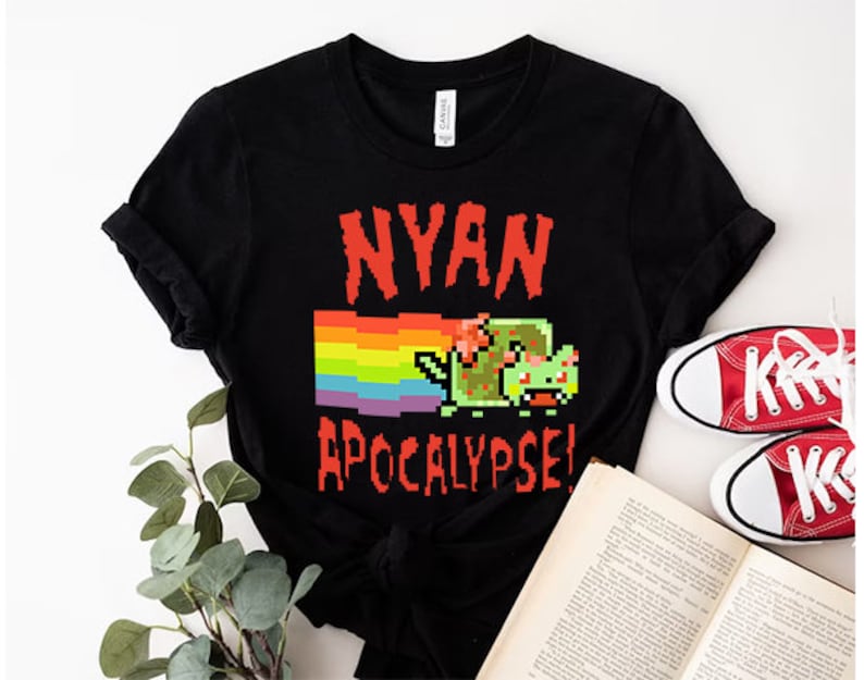 May include: Black t-shirt with a rainbow and a pixelated cat with the text "NYAN APOCALYPSE!"