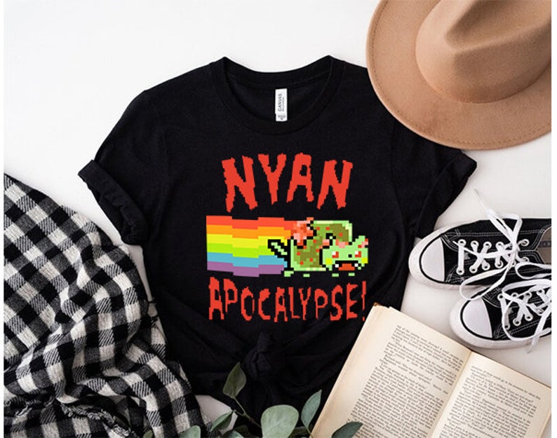 May include: Black t-shirt with a rainbow and a pixelated green cat with the text "NYAN APOCALYPSE!"